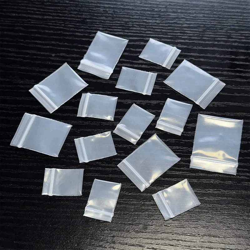 100ks Mini číry plastový taška šperky na náušnice Coin Pill Opp Balenie vrecká Malé príslušenstvo Skladovacie vrecko Opätovné použiteľné vrecká