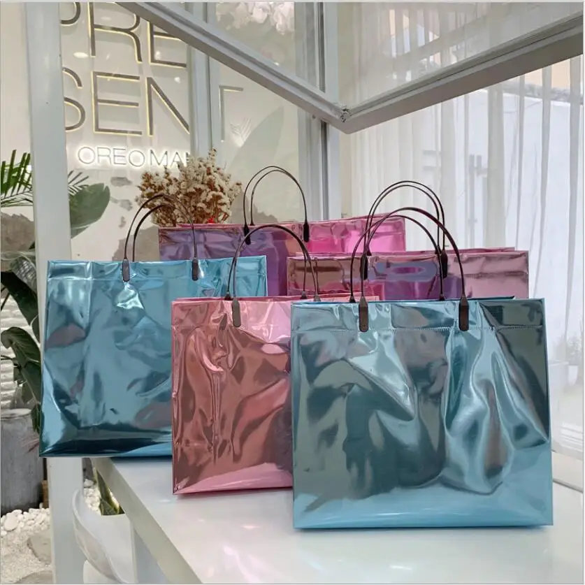 10ks kovové laserové PVC tote taška Vysoko kvalitná darčeková taška na odev Svadobné spoločenské tašky s rukoväťou