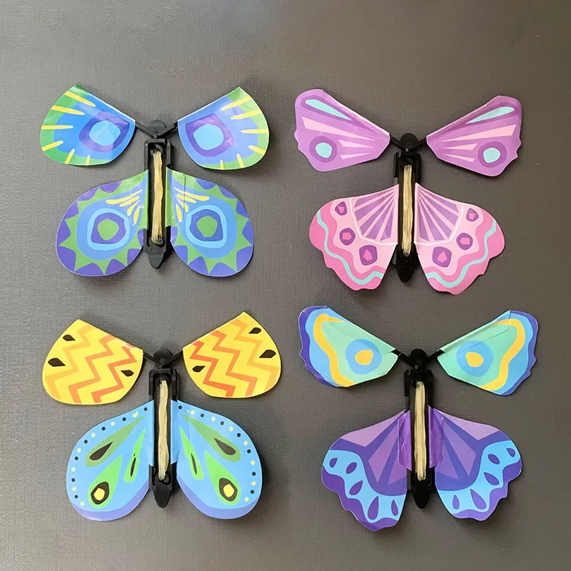 10ks Magic Wind Up Flying Butterfly Surprise Box v knihe Guma Band Poháňané hračky na narodeninovú oslavu uprednostňuje Goodie Bag Bag