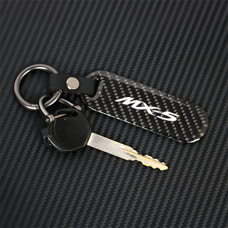 1KS uhlíkové vlákno kľúče kľúča kľúča Kľúčový reťazec Cool prívesok Keyring pre Mazda 2 3 5 6 CX3 CX5 CX7 CX9 MX5 NB NC ND 199