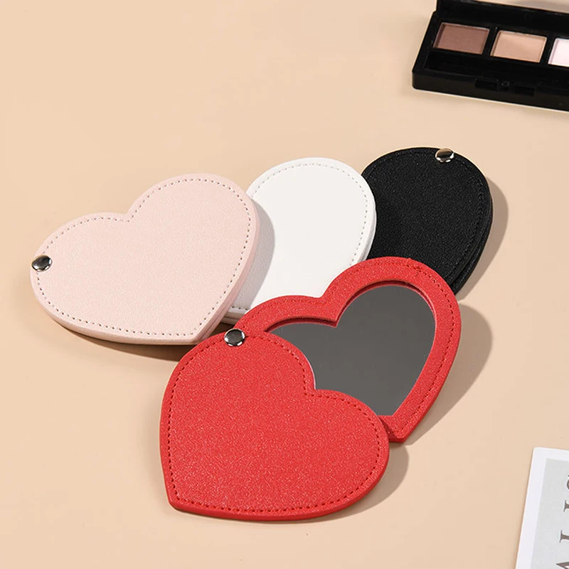 1pc Mini srdiečkové make -up zrkadlo z nehrdzavejúcej ocele Prenosný PU kryt rotačné kozmetické zrkadlá vreckové zrkadlo Krásne doplnky