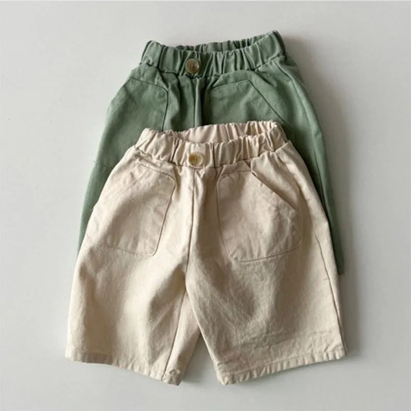 2025 Summer nové dieťa Loose Shorts Dojčiatko Solid Casy Torasts Cotton Battle Boy Girl Girl Pants Cute Kortight Shorts Detské oblečenie
