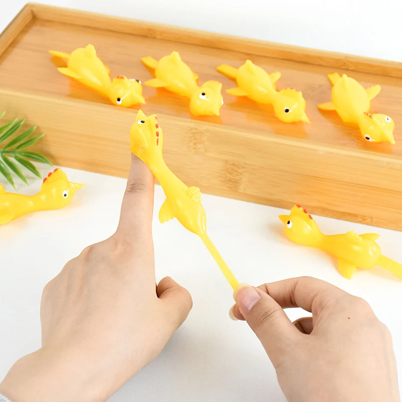 5-50ks Zábavný plastový plastový prst katapult kuracie dinosaura Game Keti narodeninové oslavy darček Piñata Filler School Cena Hračky