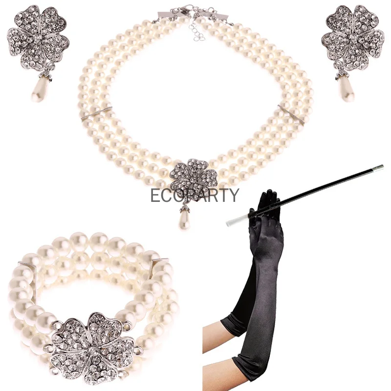 Audrey Hepburn Raňajky v Tiffanys 50. rokoch 20. storočia Kostým šperky príslušenstvo sada perly náhrdelník náušnice náramok rukavice držiak cigarety