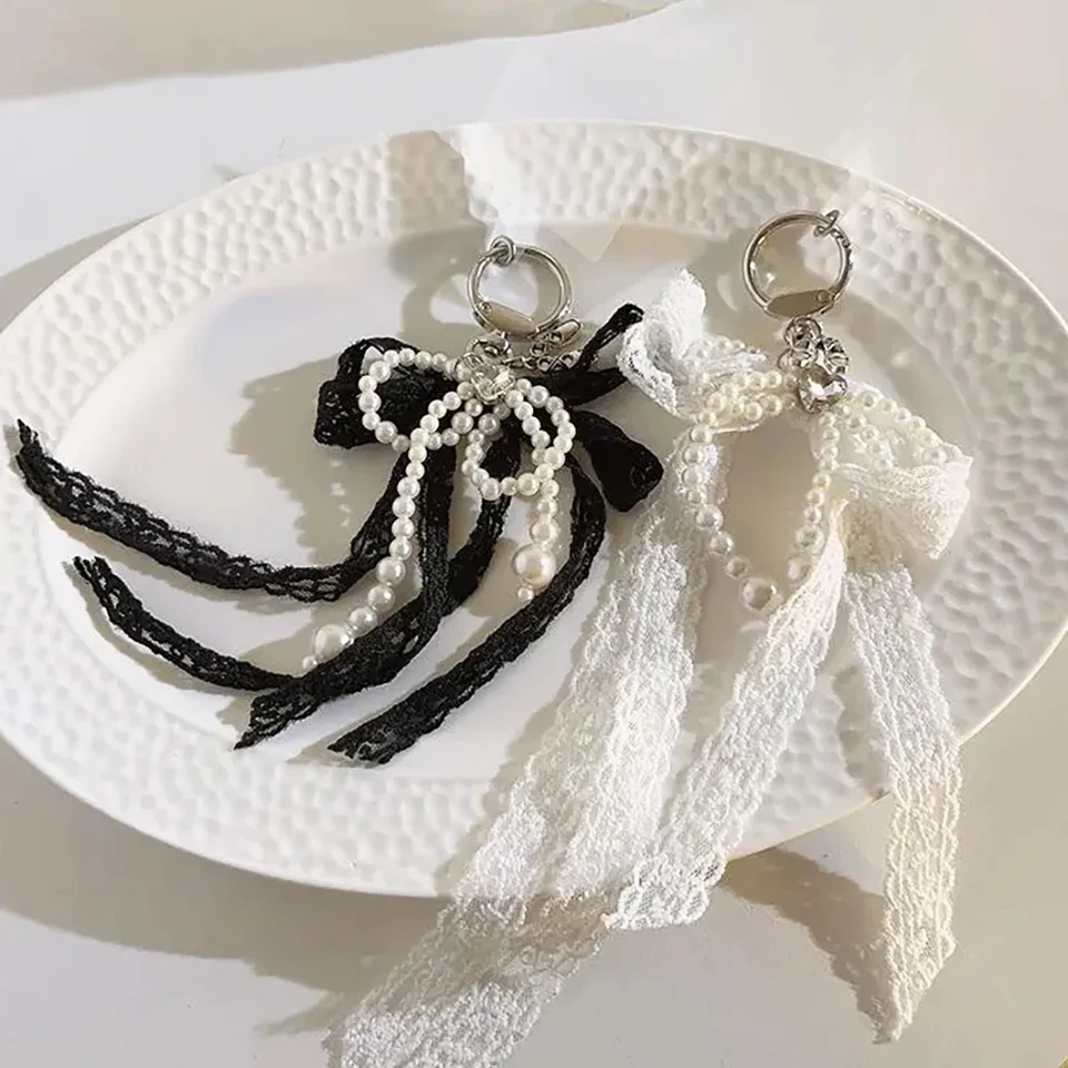 Elegantná čierna biela čipka Bowknot Pearl Bag prívesok Keychain pre mobilný telefón Girl Girl Girl Ručne vyrábaný korálkový reťazový reťazec príslušenstvo