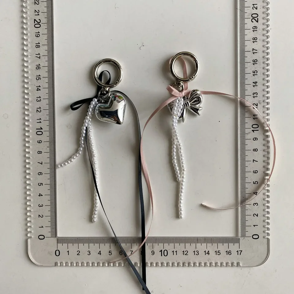 Elegantné pásové bowknot pearl srdiečko kľúčové reťaze
