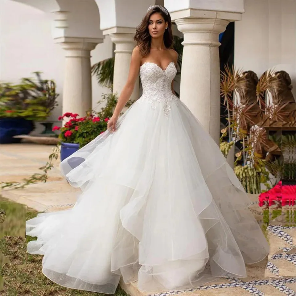 Horúce predajné šaty Organza Svadobné šaty podlahové dĺžky backless Hubles Aplikácie Flitry Svadobné šaty prispôsobené plesové šaty