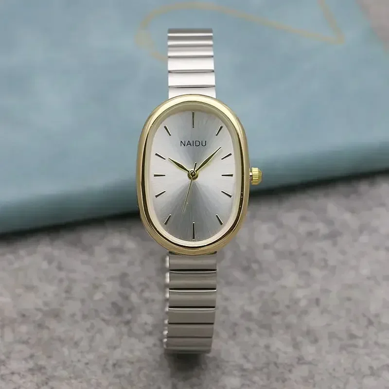 Luxusné oválne dámske Quartz Watch, Mini puzdro s malými rímskymi číslicami, loptičkami, remienok na celé kovy, výklenok hodinky