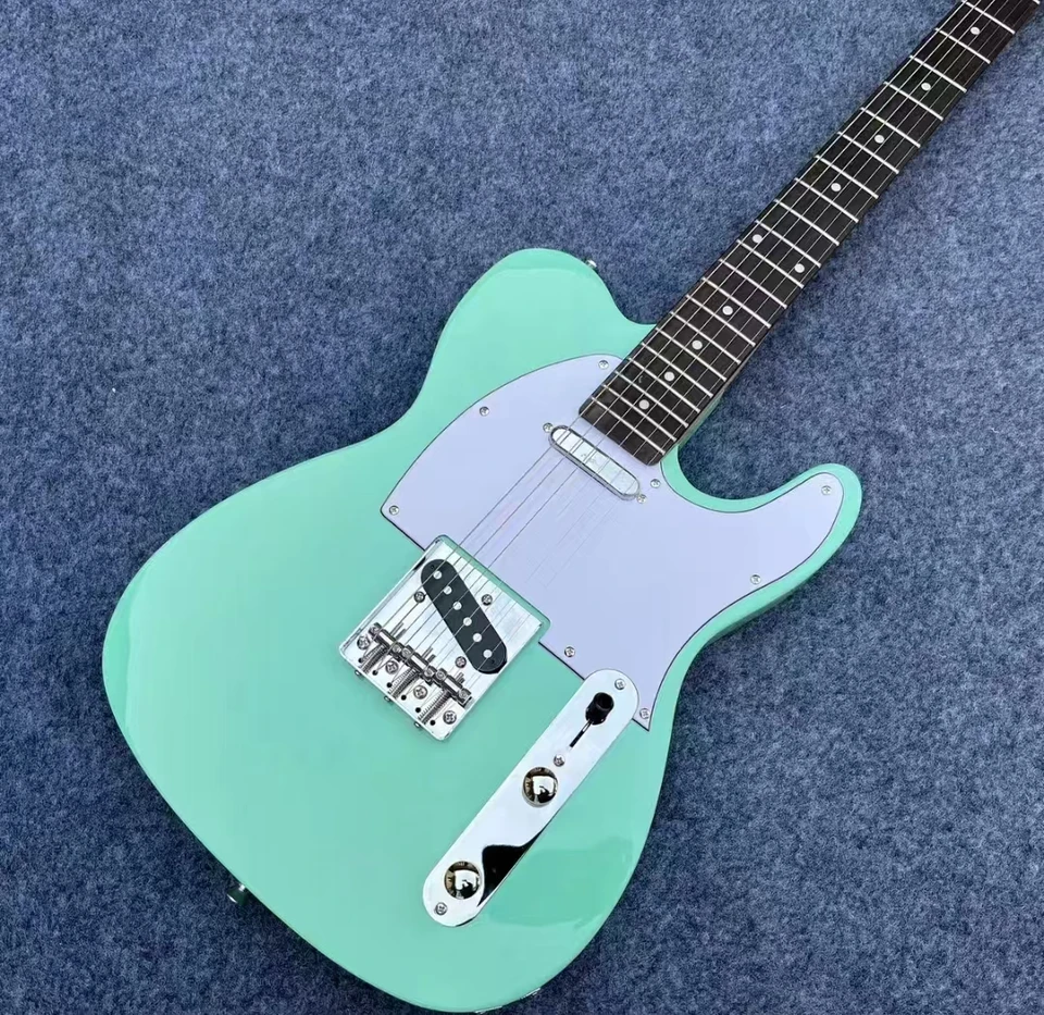 Módna surfová zelená elektrická gitara, nákladovo efektívna, veľmi populárna medzi všetkými.