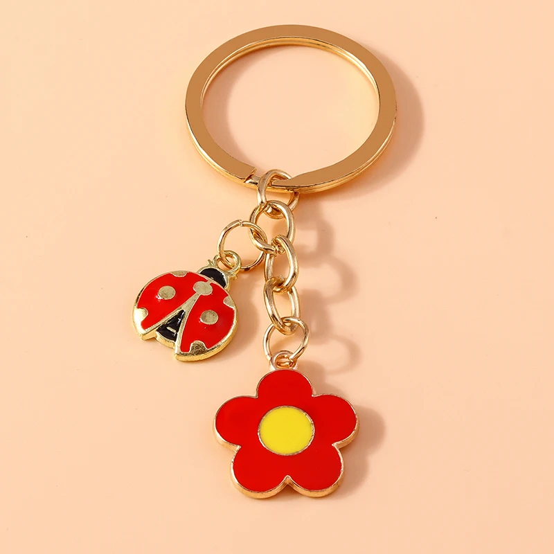 Módne kvetinové kľúče kľúče smalt hmyz hmyz ladybug kúzla Kľúčové krúžky pre ženy Men Držiteľ automobilov držiak kabelky Key reťazce DIY Príslušenstvo