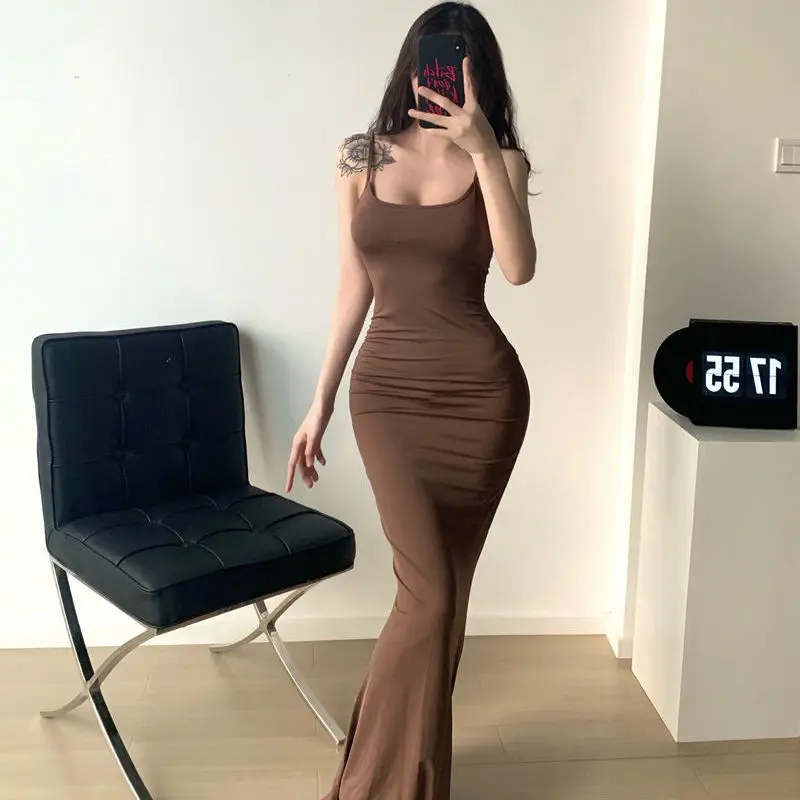 Nová čistá túžba sexy broskyňová hip sukňa Znižovanie a štíhly remienok Dlhé sukne Sexy šaty