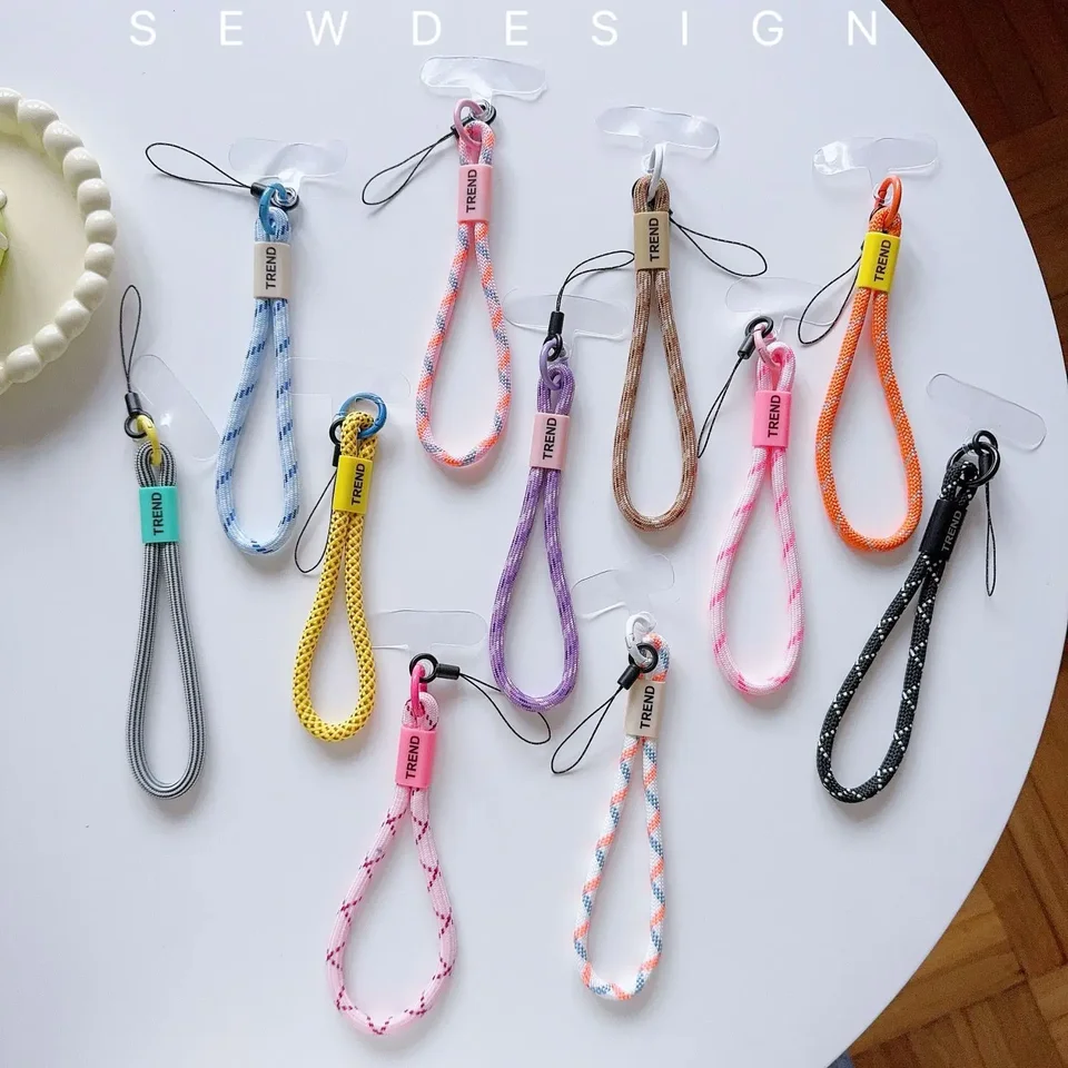 Nový tkaný mobilný telefón Lanyard, náramok, farebný tkaný šnúrka, slúchadlá, klávesy, peňaženka, bábiky, farebné bezpečnostné náramok