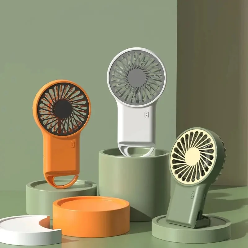 Prenosná ručná elektrická ventilátor Min Cooling Wind Air Chladenie ruky USB Desktop Nabíjateľný vreckový ventilátor s elektrickým ventilátorom Hook Electric Nový príchod
