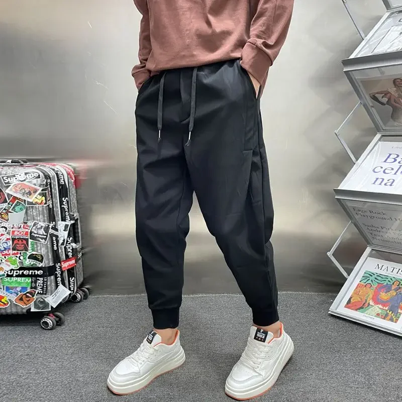 Príležitostné harlanské nohavice Men Kórea módne streetwear harajuku voľné nohavice masívne tepláky muži jogging nohavice čierne elastické homme