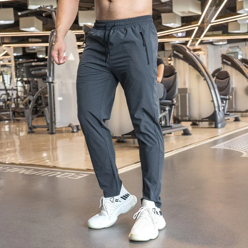 Pánske basketbalové fitness Cvičenie nohavice svalové výcvik Stretch Príležitostné golfové rýchle suché nohavice s výklenkami šnúrky