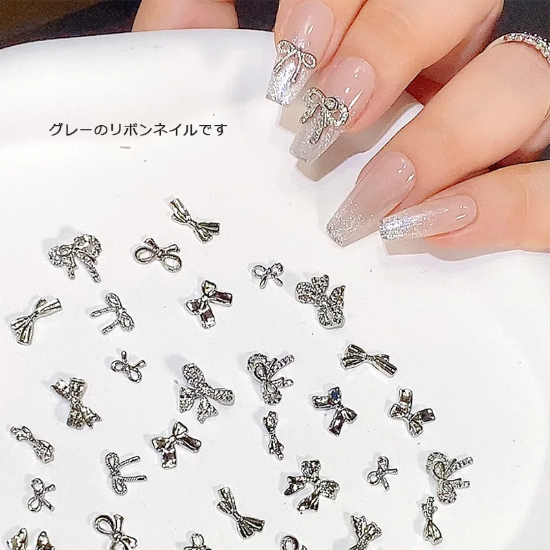 TSZS 10ks 3D strieborné multidesigny Bowknot Ribbon Nail Art Carmery kúzla sivé kamienky