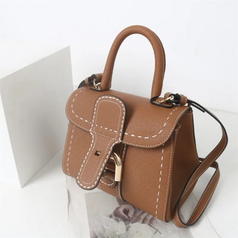 Ubellin Luxury Ramer Roather Bag 2024 Vintage podkovu gombíka ručne šitá skutočná kožená ramenná kabelka sedlová taška pre ženy