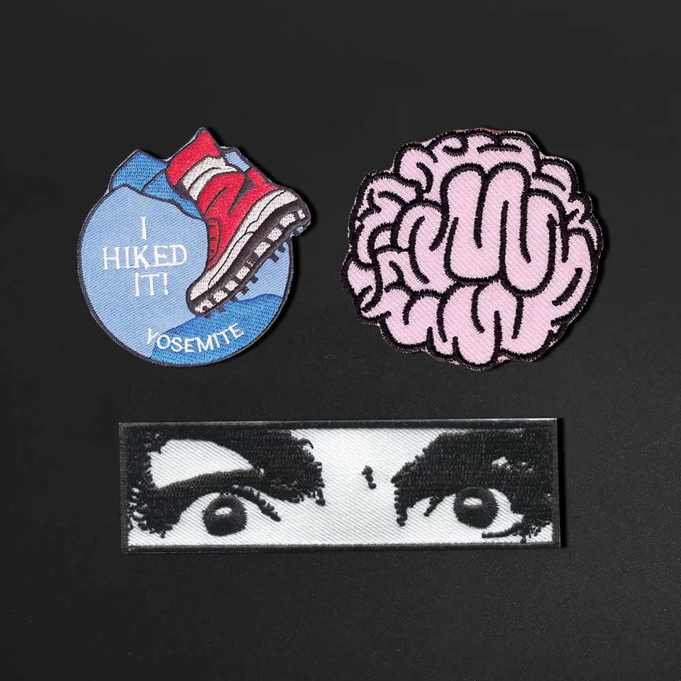 Vynikajúci rozbitý výšivkový odznak Running Aclee Eye Brain Patch Iron na podložke vyšívané na klobúkové oblečenie Malé škvrny