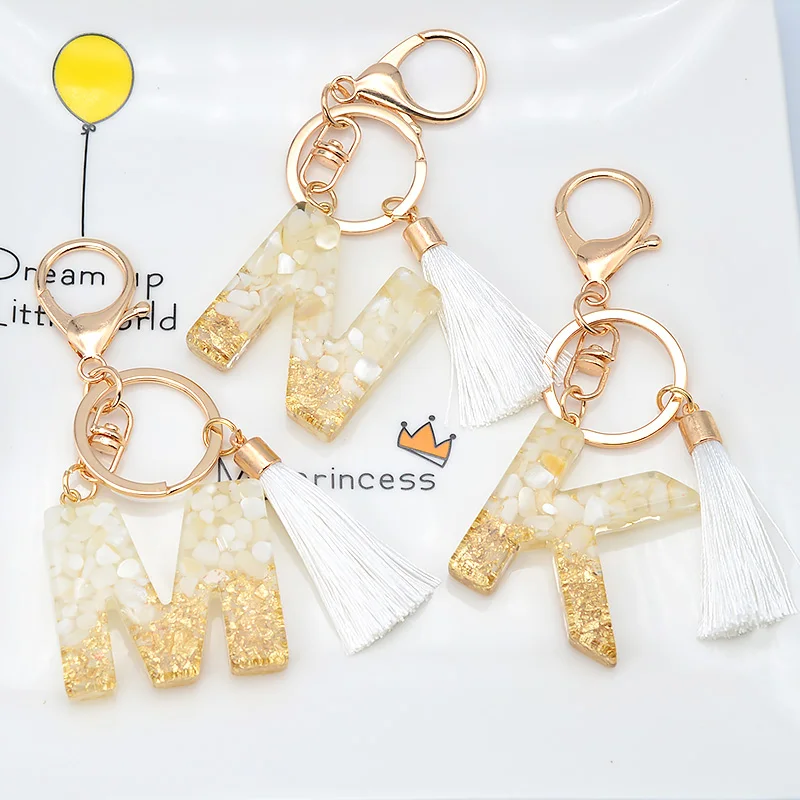Zlatá farebná fólia anglický list Klávesnica s bielym príveskom Tassel Keyring Glitter Gradient Resin Crafts Car Handbag Prívesok