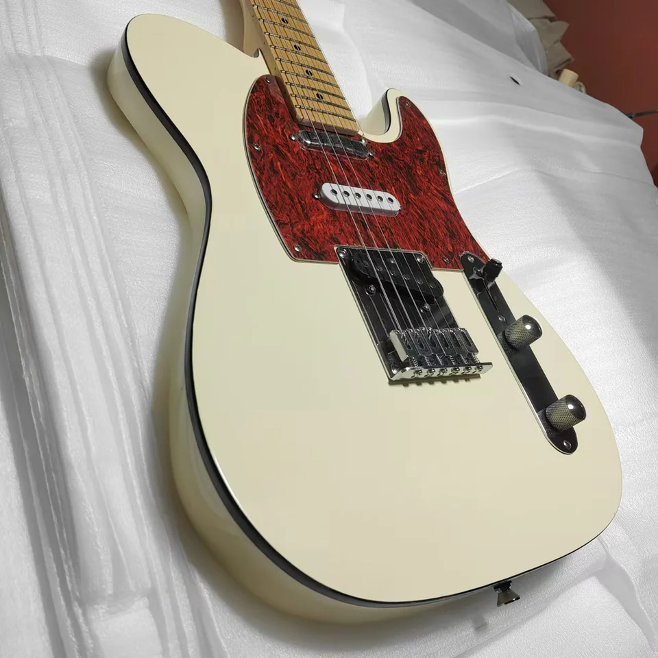 Špičková krémová žltá elektrická gitara, štýlová a krásna, dobrá na javiskový výkon.